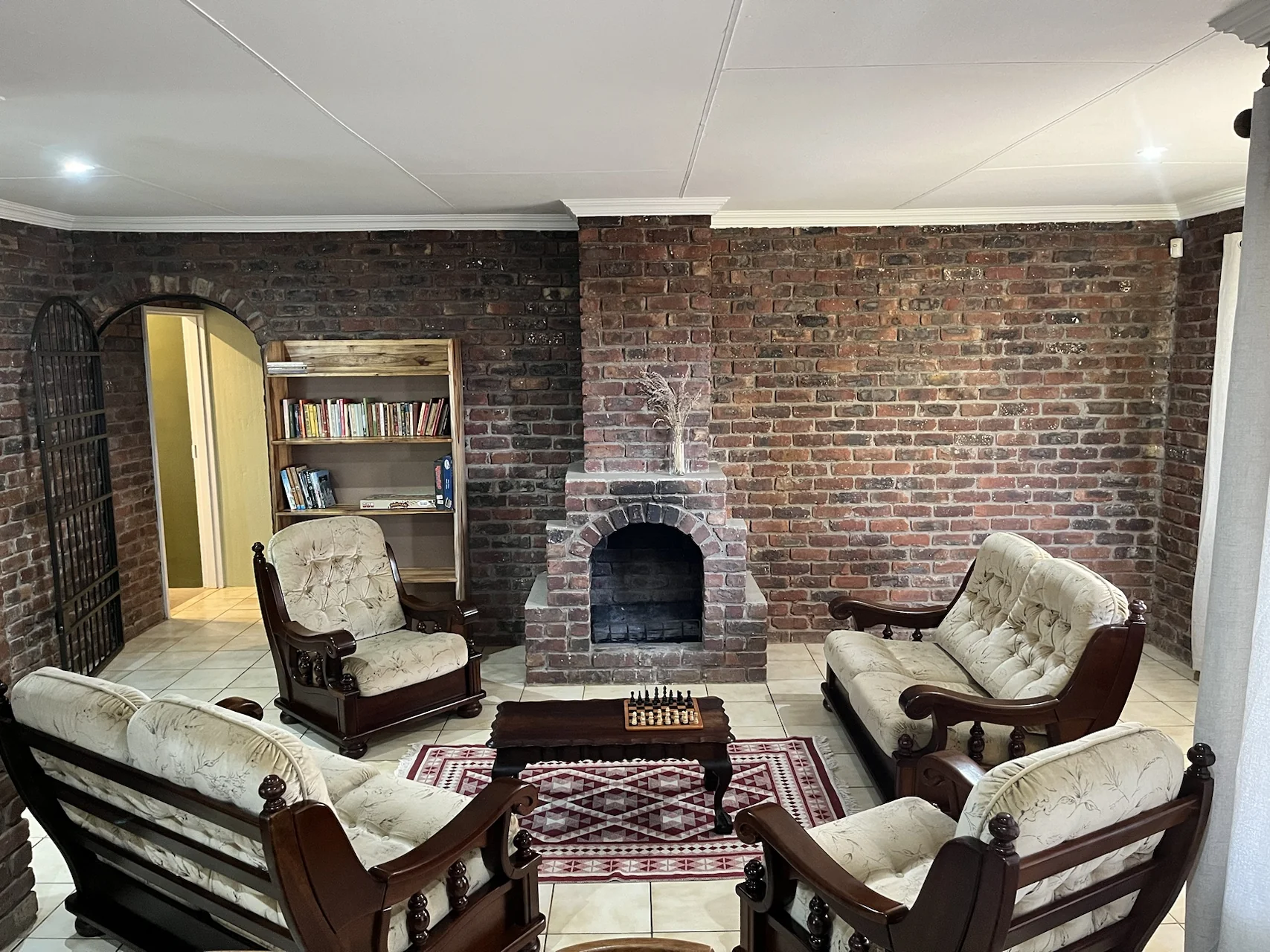 Warm living area with fireplace inside the self-catering cottage